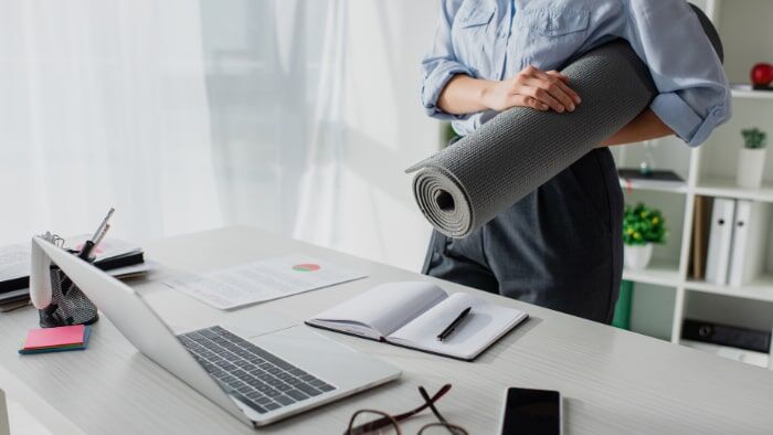 Employees taking part in a Calisthenics Ireland corporate fitness seminar, learning bodyweight training techniques for workplace wellness