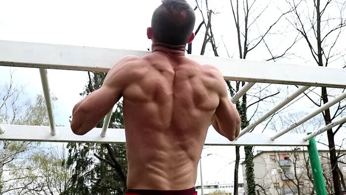 Screenshot from a calisthenics exercise tutorial by Calisthenics Ireland, demonstrating proper form for bodyweight training techniques
