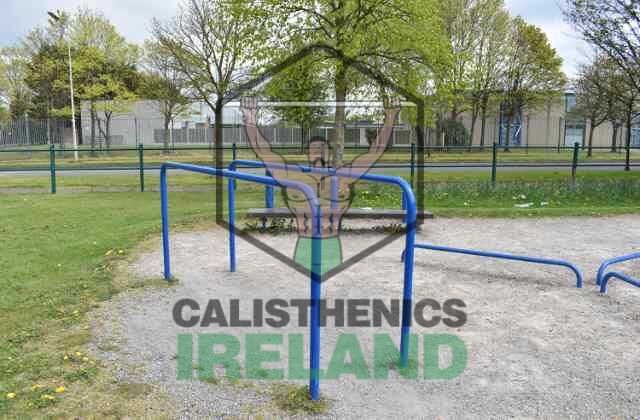 Outdoor gym at Gaels Drumfinn Park in Ballyfermot, featuring pull-up bars, dip bars, and other calisthenics training equipment for strength and fitness