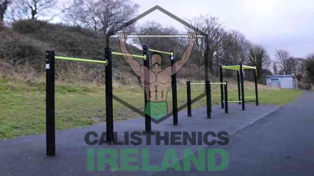 Calisthenics park at Liffey Valley Park in Dublin featuring pull-up bars, dip stations, and other outdoor workout equipment for strength and mobility training