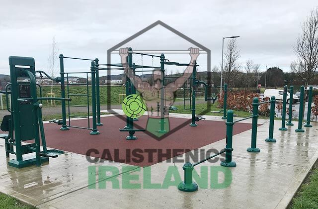 Outdoor gym area at Fairlane in Dungarvan, Waterford, with parallel bars and freestanding rigs for functional strength exercises