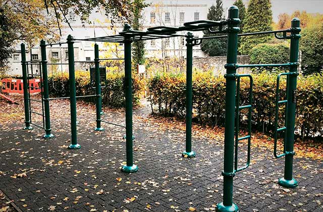 Outdoor gym at The Warren in Roscommon, equipped with calisthenics bars and workout stations for strength and functional training